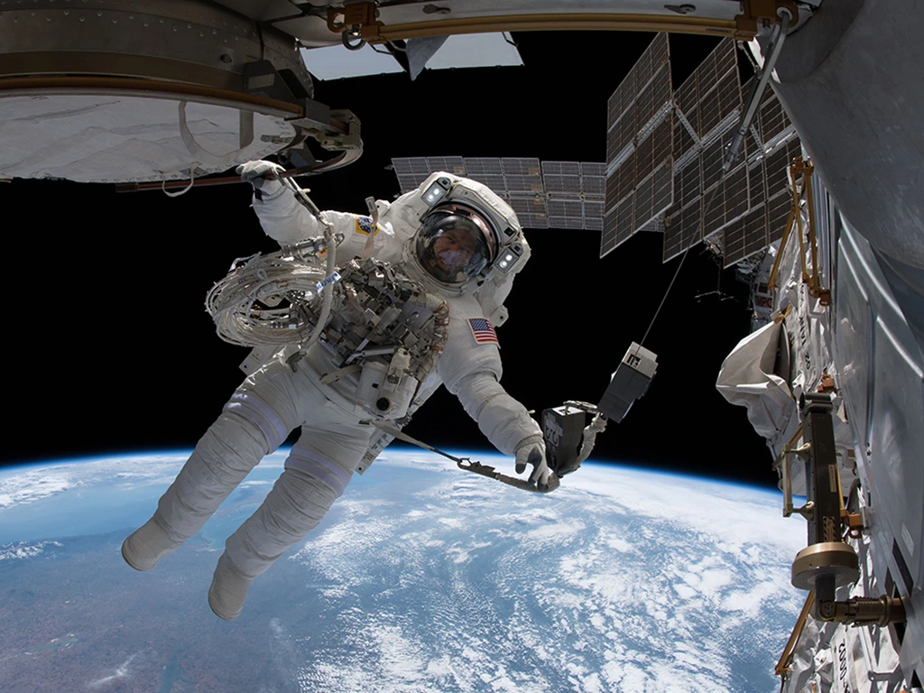 Astronaut conducting experiments in the vastness of space - Space Exploration 2024.