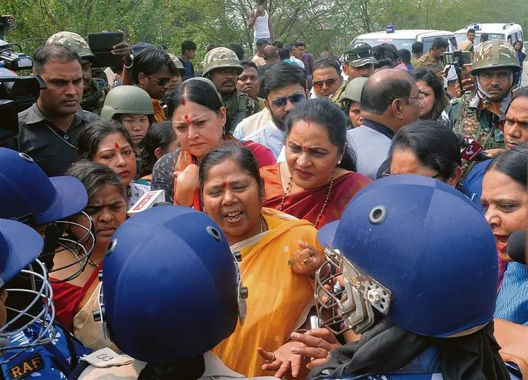 Destruction in Sandeshkhali following the violence, showcasing damaged buildings and streets.