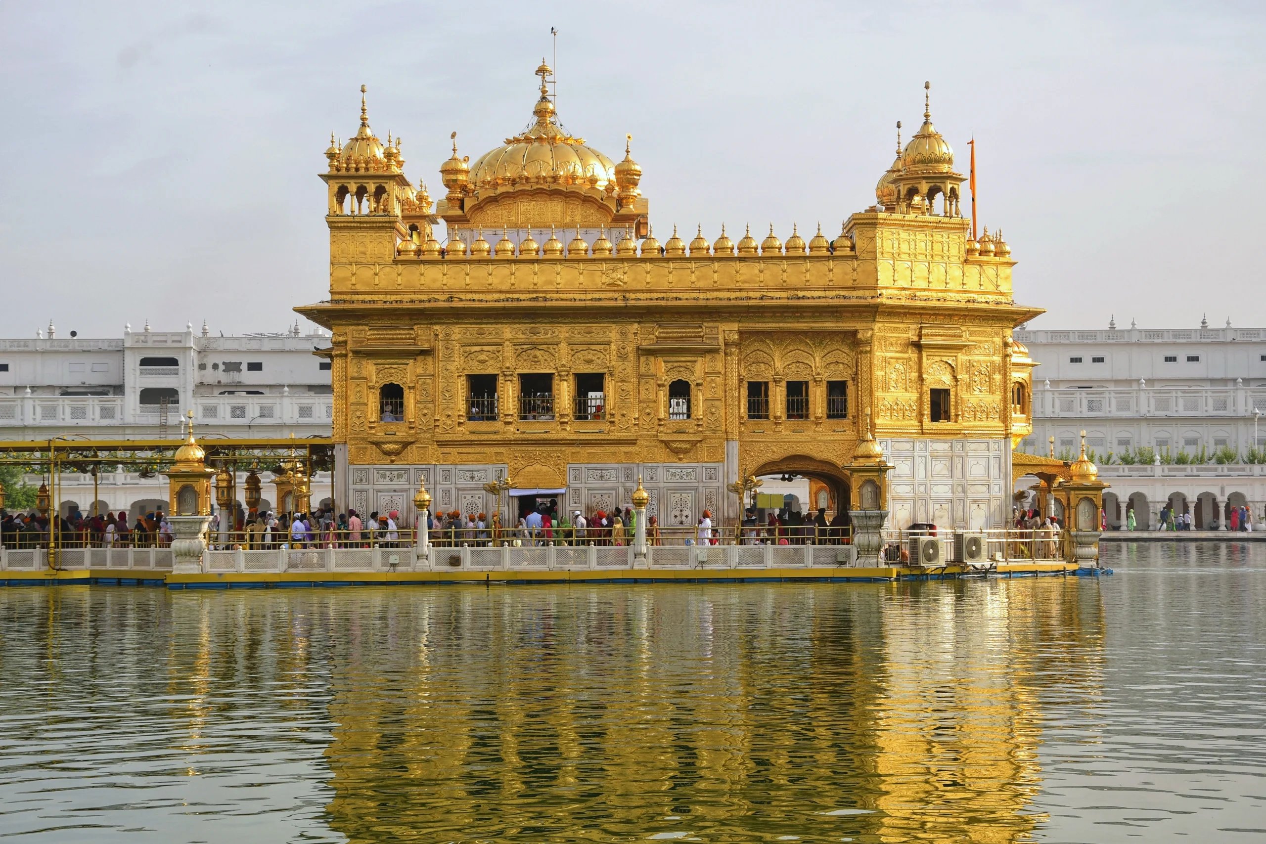 Golden Temple at sunset, reflecting in the tranquil waters of Amrit Sarovar