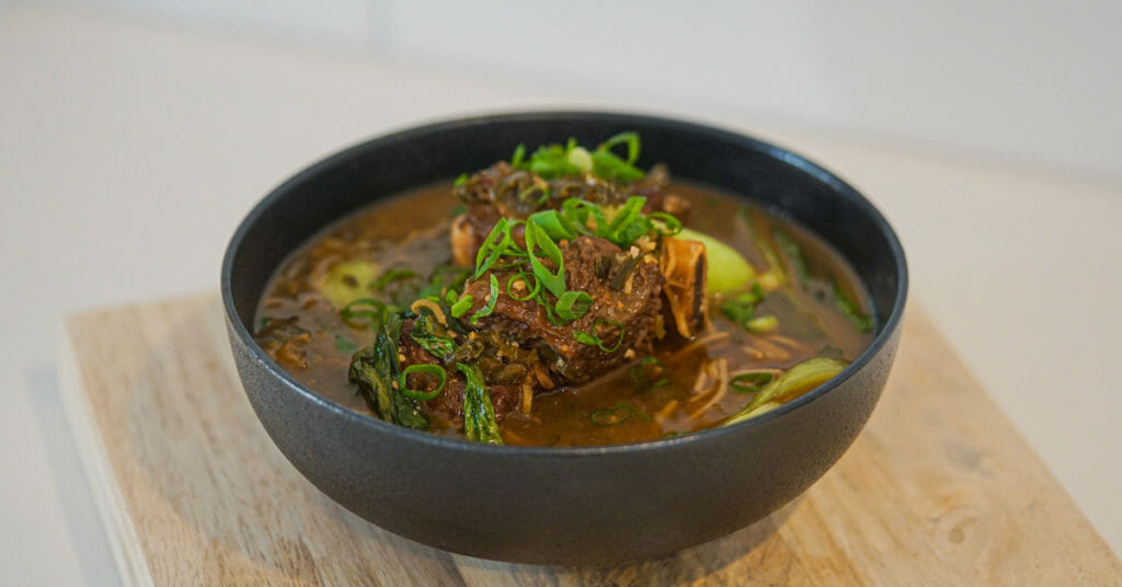 succulent beef ribs simmered in a fragrant broth, inviting viewers to savor the delicious flavors of homemade beef rib soup