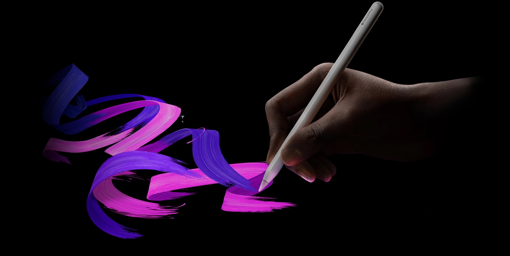 Apple Pencil Pro magnetically attached to an iPad, showcasing its sleek design and wireless charging capabilities.