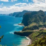 Dramatic cliffs and lush greenery of Madeira's coastline.