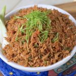 Spicy Schezwan Fried Rice served with fresh spring onions