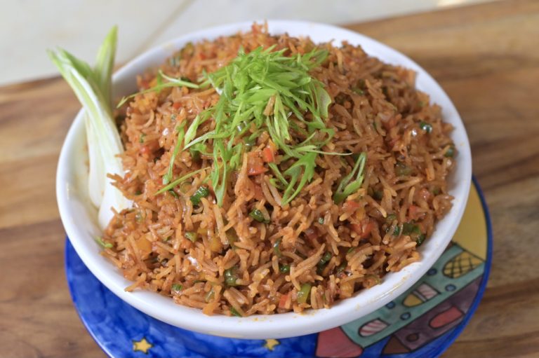 Spicy Schezwan Fried Rice served with fresh spring onions